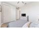 Bedroom with ceiling fan, double closet, and door leading to the bathroom at 4306 Nw 54Th Ter, Ocala, FL 34482