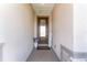 Welcoming front porch with a glass front door, potted plants, and a 'Welcome' sign at 4306 Nw 54Th Ter, Ocala, FL 34482