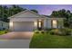 Charming single-story home featuring a two-car garage, landscaped yard and beautiful brick driveway at 4306 Nw 54Th Ter, Ocala, FL 34482