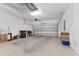 Spacious two-car garage with ample room for storage, featuring an automatic door and lighting at 4306 Nw 54Th Ter, Ocala, FL 34482