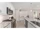 Well-equipped kitchen with a stainless dishwasher, oven, and granite countertops at 4306 Nw 54Th Ter, Ocala, FL 34482