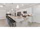 Spacious kitchen features white cabinets, stainless appliances and a large center island with seating at 4306 Nw 54Th Ter, Ocala, FL 34482