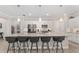 Modern kitchen showcasing a large island with barstool seating and pendant lighting at 4306 Nw 54Th Ter, Ocala, FL 34482