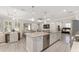 Expansive kitchen with a large island, stainless appliances, and open layout to living spaces at 4306 Nw 54Th Ter, Ocala, FL 34482