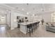 Beautiful kitchen with white cabinets, stainless appliances, and a granite island with seating at 4306 Nw 54Th Ter, Ocala, FL 34482