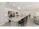 Spacious kitchen features white cabinets, stainless appliances and a large center island with seating at 4306 Nw 54Th Ter, Ocala, FL 34482