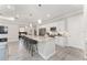 Open kitchen featuring an island with barstools, and a seamless transition into the living space at 4306 Nw 54Th Ter, Ocala, FL 34482
