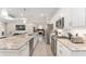 Open-concept kitchen flowing into the living area, featuring a spacious island at 4306 Nw 54Th Ter, Ocala, FL 34482