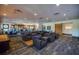 Stylish lounge area with comfortable seating, ample lighting, and modern decor, creating a relaxing atmosphere at 4306 Nw 54Th Ter, Ocala, FL 34482