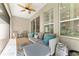 Cozy screened patio with comfortable seating and tranquil views of the surrounding landscape at 4306 Nw 54Th Ter, Ocala, FL 34482