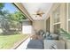 Serene screened patio offering an inviting space to relax and enjoy the views of the lush backyard at 4306 Nw 54Th Ter, Ocala, FL 34482