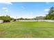 Spacious, fenced backyard with lush green grass and mature trees at 4324 Sw 98Th Ln, Ocala, FL 34476