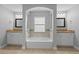 Bright bathroom featuring a tub, window, double vanity, and granite countertops at 4324 Sw 98Th Ln, Ocala, FL 34476