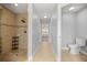 Modern bathroom features a walk-in shower, tile, and contemporary fixtures, offering a spa-like experience at 4324 Sw 98Th Ln, Ocala, FL 34476
