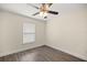 Bedroom featuring hardwood floors, a ceiling fan, and a bright window at 4324 Sw 98Th Ln, Ocala, FL 34476