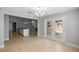 Spacious dining room with access to patio and a modern chandelier provides a sophisticated ambiance at 4324 Sw 98Th Ln, Ocala, FL 34476