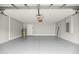 Garage features a painted floor, modern door, and electrical panel at 4324 Sw 98Th Ln, Ocala, FL 34476