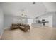 Open floor plan features a kitchen island and modern fixtures, seamlessly flowing into the spacious living area at 4324 Sw 98Th Ln, Ocala, FL 34476