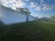 Spacious backyard featuring a grassy lawn, ideal for relaxation and outdoor enjoyment at 45 Hickory Track Way, Ocala, FL 34472