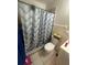 Compact bathroom with shower, toilet, and vanity, featuring a clean and functional design at 45 Hickory Track Way, Ocala, FL 34472