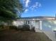 Charming single-story home featuring a one-car garage and classic curb appeal with tidy landscaping at 45 Hickory Track Way, Ocala, FL 34472