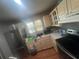 Bright kitchen features updated stainless steel appliances and lots of natural light at 45 Hickory Track Way, Ocala, FL 34472