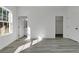An empty bedroom with an ensuite bathroom and closet, letting in light from the large window at 455 Marion Oaks Dr, Ocala, FL 34473