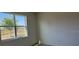 Bright and airy bedroom with plush carpet and a large window offering a view at 5077 Stokes Way, Wildwood, FL 34785