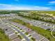 This aerial shows this house, in a well-planned community with green spaces at 5220 Sunshine Dr, Wildwood, FL 34785