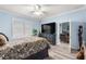 Spacious bedroom with comfortable furniture and a view to the living room at 5220 Sunshine Dr, Wildwood, FL 34785