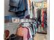 Walk-in closet with shelving and rods for optimal organization and storage at 5220 Sunshine Dr, Wildwood, FL 34785