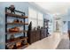 Dining and Entry showcasing decorative shelving, wainscoting and natural light enhancing the space at 5220 Sunshine Dr, Wildwood, FL 34785