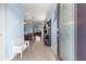 Inviting entryway featuring tile flooring, a decorative console table, and a view of the dining and living areas at 5220 Sunshine Dr, Wildwood, FL 34785