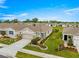 A charming single-Gathering home with a well-maintained lawn, a two-car garage, and curb appeal at 5220 Sunshine Dr, Wildwood, FL 34785