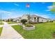 Well-maintained home featuring nice landscaping, an American flag, and great curb appeal at 5220 Sunshine Dr, Wildwood, FL 34785