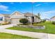 Well maintained home boasts stone accents, charming landscaping, and an inviting front yard at 5220 Sunshine Dr, Wildwood, FL 34785