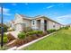 Inviting home with stone accents, covered entry, and beautifully landscaped front yard at 5220 Sunshine Dr, Wildwood, FL 34785