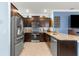 Well-equipped kitchen featuring granite countertops, stainless steel appliances, and ample cabinet space at 5220 Sunshine Dr, Wildwood, FL 34785