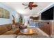 Open living space with kitchen view, modern decor, and comfortable seating arrangements at 5220 Sunshine Dr, Wildwood, FL 34785