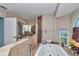 Bathroom featuring a large soaking tub, tile surround, walk-in shower, and vanity area at 5350 Sw 82Nd St, Ocala, FL 34476