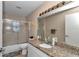 Well-lit bathroom features granite countertops, shower, and modern fixtures at 5350 Sw 82Nd St, Ocala, FL 34476