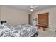Comfortable bedroom with fan, bench, and neutral decor at 5350 Sw 82Nd St, Ocala, FL 34476