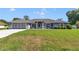 Sprawling single-story home with manicured lawn and shade trees at 5350 Sw 82Nd St, Ocala, FL 34476