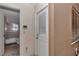 Hallway leading to the bathroom and backyard with a view of the screened-in pool area at 5350 Sw 82Nd St, Ocala, FL 34476
