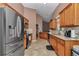 Spacious kitchen with stainless steel appliances and light brown cabinetry and tile flooring at 5350 Sw 82Nd St, Ocala, FL 34476