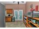 Bright kitchen featuring wood cabinets, tile floors, and a door that leads to the outside at 5350 Sw 82Nd St, Ocala, FL 34476