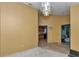 Open-concept living room boasts light walls and view of the kitchen at 5350 Sw 82Nd St, Ocala, FL 34476