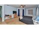 Large main bedroom with a ceiling fan, TV, and windows providing natural light at 5350 Sw 82Nd St, Ocala, FL 34476