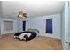 Spacious main bedroom with a ceiling fan and windows providing natural light at 5350 Sw 82Nd St, Ocala, FL 34476
