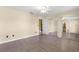 Spacious bedroom with tile floors, a ceiling fan, and sliding mirror closet doors to maximize space and storage at 5580 Se 21St Ln, Ocala, FL 34480